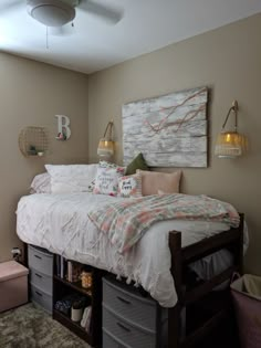 a bed sitting under a painting on top of a wooden shelf next to a window