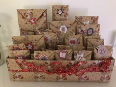 a bunch of brown boxes with red and white bows on them sitting next to each other