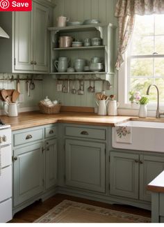 an image of a kitchen setting with green painted cupboards and white appliances in it