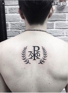 a man with a tattoo on his back