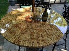 a table made out of wine corks on a patio