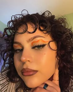 Fun Orange Makeup, Graphic Eyeliner Orange, Orange Flower Makeup, Orange Brown Makeup Looks, Orange Inner Corner Makeup, Orange Hair Makeup Looks, Red Orange Makeup Looks, Orange Eye Makeup Looks, Orange And Pink Makeup Looks