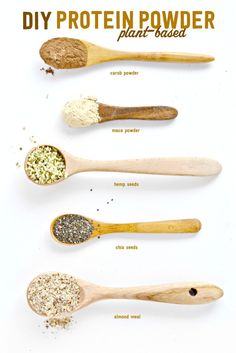 wooden spoons filled with different types of powder and seasoning on top of each other