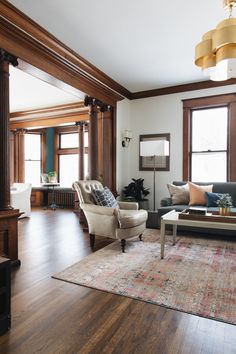 a living room filled with furniture and wooden floors