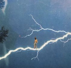 a man standing on top of a lightning bolt