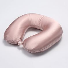 an inflatable pink pillow on a white background