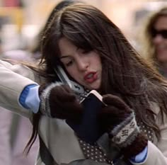 a young woman is talking on her cell phone