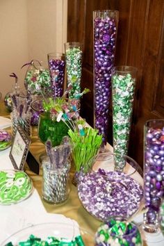 the table is set with candy and candies