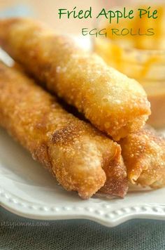 fried apple pie eggrolls on a white plate