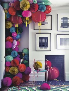 the room is decorated with colorful paper lanterns