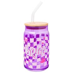 a purple glass jar with a straw in it