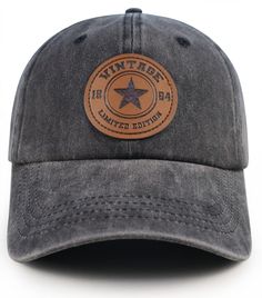 a gray hat with a leather patch on the front and back, sitting against a white background