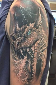 a man with a dragon tattoo on his arm