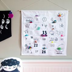 a child's wall calendar hanging on the wall