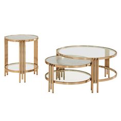 three tables with glass tops and gold metal frames on each side, one is round