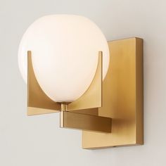 a light that is on the side of a wall with a white ball in it