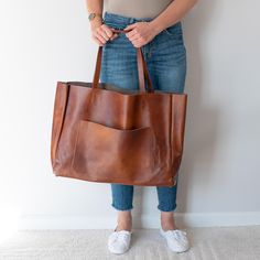 OVERSIZED LEATHER TOTE BAG - LEATHER SHOPPING BAG - LARGE TOTE This Leather Handbag is made of high quality natural leather. It's is very roomy - perfect for school, work and travel - great option as your everyday bag. Large interior provides a lot of space for all the daily essentials (books, cosmetic bag, accessories, laptop and other electronic devides, clothes and more). Inside the shopper bag there is an additional pocket with zipper for other small items.  There is also large pocket outsid Everyday Tote, Leather Handbags Tote, Tote Bag Leather, Daily Essentials, Large Tote Bag, Shopper Bag, Everyday Bag, Large Tote, Leather Tote Bag