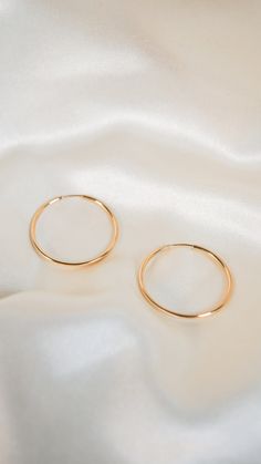 * Earring Material: 14K Yellow Gold * Earring Width: 1.5 Inch Hoop, 2 MM Width * Stone Weight & sizes: N/A * Overall weight: 3.5g * Earring material: 14k yellow gold, Wire Backing Classic 14k Gold Filled Hoop Earrings For Anniversary, Gold Round Huggie Earrings With Halo, 14k Gold Round Huggie Earrings With Halo, Gold Huggie Earrings With Halo, Gold Round Halo Huggie Earrings, 14k Gold Round Halo Huggie Earrings, Yellow Gold Small Hoop Halo Earrings, Yellow Gold Halo Small Hoop Earrings, Tarnish-resistant Luxury Hoop Earrings