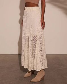 Embrace your free-spirited style with the Sundrenched Lace Maxi Skirt, a dreamy piece that captures the essence of New Boheme. This skirt features a lightweight lace fabric overlay that flows effortlessly with every step, creating a romantic silhouette perfect for sun-soaked days. The elastic waistband offers comfort a Chic Delicate Lace For Summer, Chic Cream Skirt With Lace Trim, Chic Lace Maxi Skirt For Summer, Chic Lace Maxi Skirt With Lace Trim, Lace Skirt With Lace Work, Beige Lace Skirt With Lace Patchwork, Elegant Summer Skirt With Lace Patchwork, Delicate Lace Skirt For Spring, Lace Patchwork Maxi Skirt