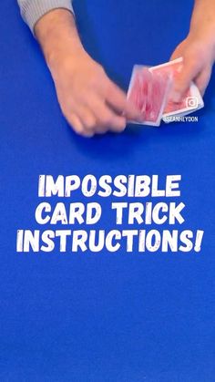 a person is playing cards on a blue table with the words impossible card trick instructions