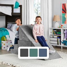 two children playing on a slide in their bedroom