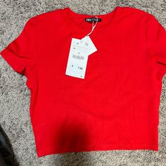 Zara Medium Red Crop Top Solid Color Neutral Fitted Red T-shirt For Summer, Basic Red Summer T-shirt, Zara Red Short Sleeve T-shirt, Red Short Sleeve T-shirt By Zara, Red Cotton T-shirt By Zara, Red Stretch Zara Tops, Red Stretch Tops By Zara, Red Cotton Zara T-shirt, Fitted Red Zara Tops