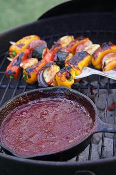 some food is cooking on a grill with tongs