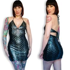 Vintage Y2K Blue Metallic Silver Galactic Holographic Snakeskin Body Con Mini Dress! Features: - halter top that ties with spaghetti straps - plunging V neckline - fitted triangle bust - nipped in waist with ties  - curve-hugging body con style - low, backless cut Label: "Formula X" Excellent condition!  Bust: 30"- 38" / open due to open back; A-C cup Waist: 26"- 34" / open / adjustable  Hips: 36"- 44"  Length: 30" Model is 5' 9" and measures 33-28-41. Accessories not included. We would be happy to show you any additional pictures!! Feel free to message me with any additional questions and please read my policies before committing to buy. Thank you! All sales are final. We do not accept returns or exchanges. Computer monitors are all different & may reflect color differently. If you'd like Y2k Fitted Halter Top For Night Out, Fitted Y2k Mini Dress For Evening, Y2k Halter Neck Dress For Night Out, Y2k Style Halter Neck Club Dress, Fitted Y2k Backless Dress, Metallic Fitted Halter Top For Summer, Fitted Metallic Backless Dress, Y2k Fitted Backless Dress, Blue Y2k Mini Dress For Party