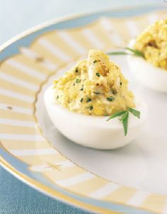 two deviled eggs are sitting on a plate