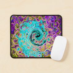 a computer mouse pad with a colorful swirl design on the front and side of it