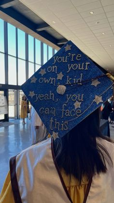 a graduation cap that says you're on your own kid yeah you can face this