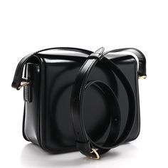 This is an authentic CELINE Shiny Calfskin Small Triomphe in Black. This chic shoulder bag is crafted of fine smooth calfskin leather in black. The bag features an adjustable leather strap with polished gold hardware and a matching gold press lock on the crossover flap. The flap opens to a matching leather interior with zipper and patch pockets. Celine Box, Vanity Case, Black 7, Black Cross Body Bag, Flap Bag, Leather Interior, Pink Bag, Gold Hardware, Crossover