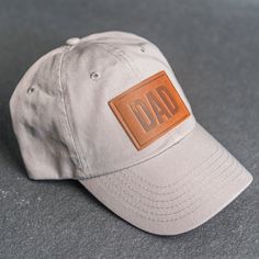 Elevate dad’s style with new Leather Patch Unstructured Style Hat stamped with the word Dad. All hats ship for free within the US! SPECS Leather Patch Color Options: Natural Dublin, Nut Brown Dublin, or Cafe Chromexcel Hat Color Options: Choose from Stone, Black, Navy, or Gray All of our products are made to order by hand in McKinney, TX MATERIALS REAL HORWEEN LEATHER: Premium Full-Grain Leather. Each patch is one-of-a-kind and made from part of a whole hide of leather. There will be unique vari Texas Stamp, Deer Stamp, Brown Deer, Brass Hand, Horween Leather, Panel Hat, Stamp Design, Font Styles, Personalized Leather