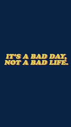 the words it's a bad day not a bad life on a dark background