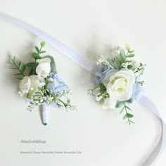 two bridal bouquets with blue and white flowers are on the side of a ribbon