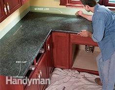 a man standing in front of a kitchen counter