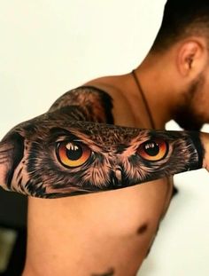 a man with an owl tattoo on his arm