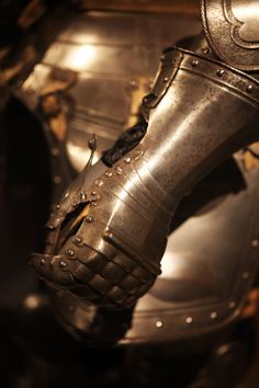 a close up of a metal armor on display