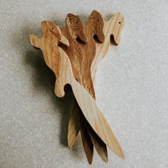 a wooden object with two fish on it