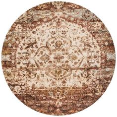 a round rug with an ornate design on the center and bottom in red, brown, beige