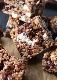 chocolate and marshmallow squares are stacked on top of each other, ready to be eaten