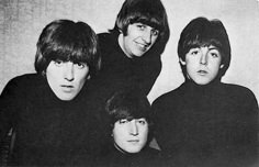 the beatles are posing for a photo together