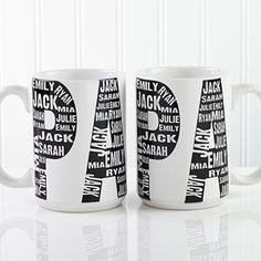 two white coffee mugs with black and white letters on them, one has the letter p in different languages