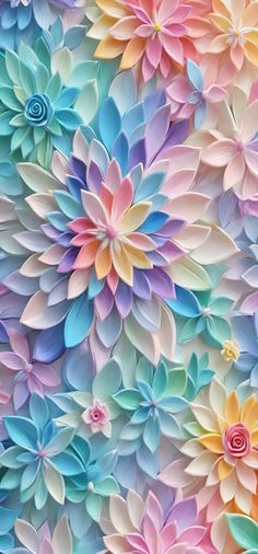 colorful paper flowers are arranged on the wall