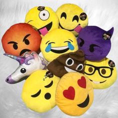 a bunch of emoticions that are sitting on top of each other in the middle of a pile