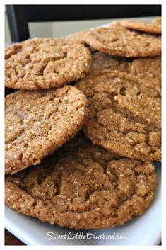 several cookies are stacked on a white plate