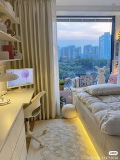 a bedroom with a bed, desk and large window looking out on the cityscape