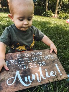 a baby holding a sign that says, if you think we're cute, wait until you see our anette