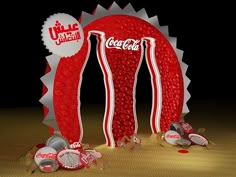 coca - cola advertisement displayed on wooden floor with bottle caps scattered around it in dark room