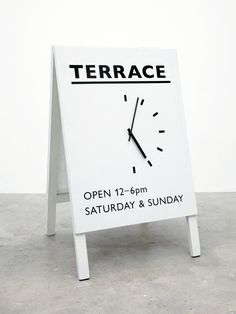 a sign with a clock on it that says terrace open 11 - 9pm saturday and sunday